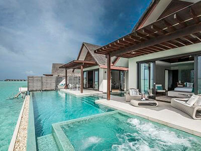 Niyama Private Islands overwater villa deck area with pool and jacuzzi