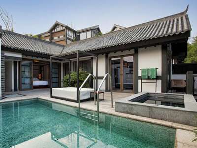 Banyan Tree Chongqing Beibei Double Pool Villa deck with pool and jacuzzi