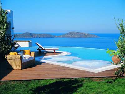 Elounda Gulf Villas Royal Spa Villa terrace with infinity pool and jacuzzis
