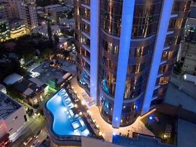 Embassy Suites Santo Domingo night view of pool area